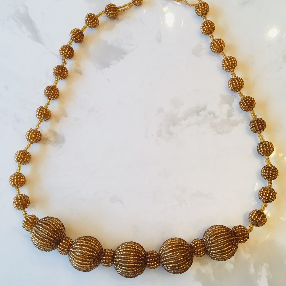 Yellow / gold color beaded ball necklace